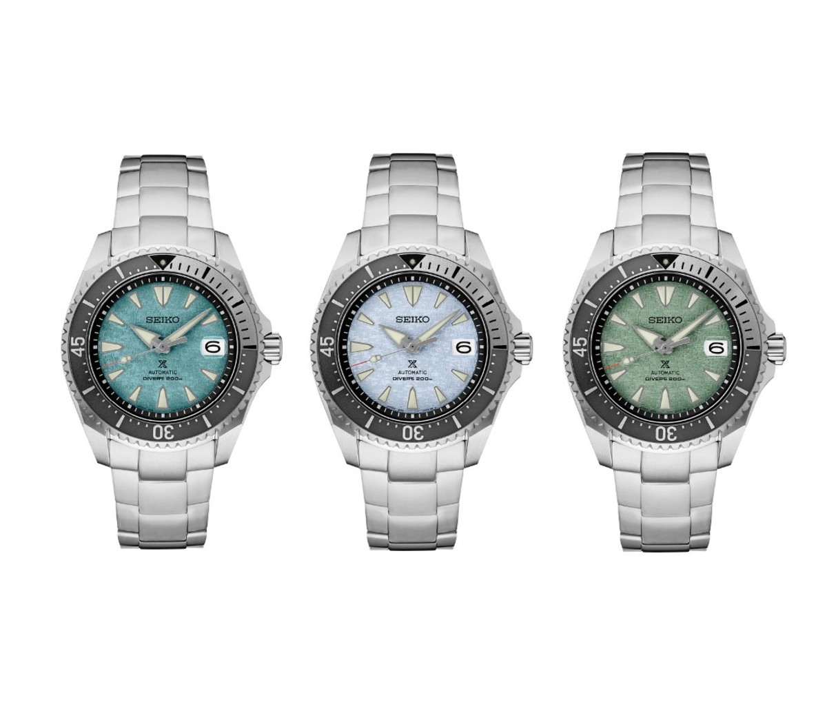 Trio of silver watches with blue, aquamarine, and seafoam green faces