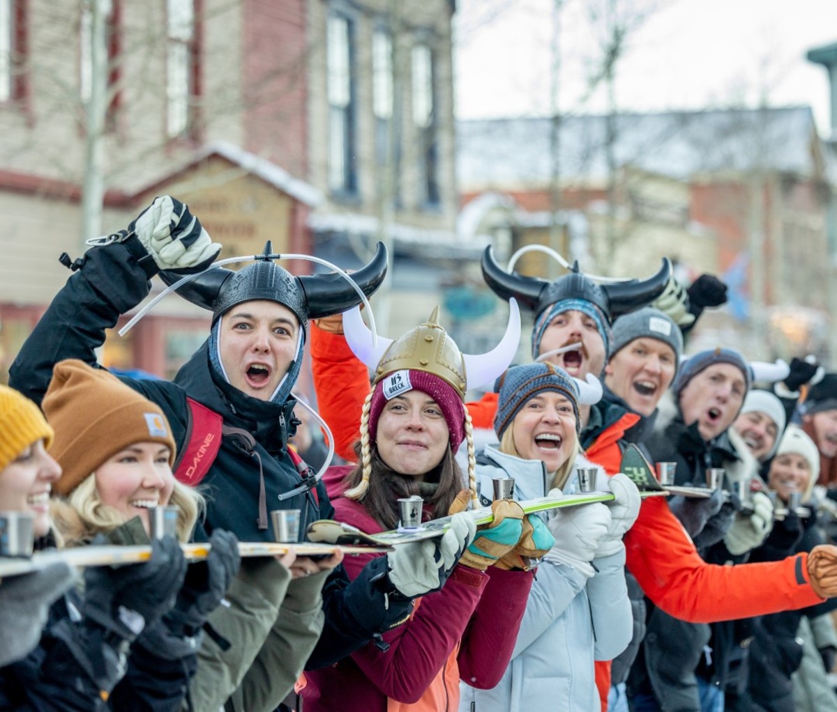 Long line of people doing shot ski