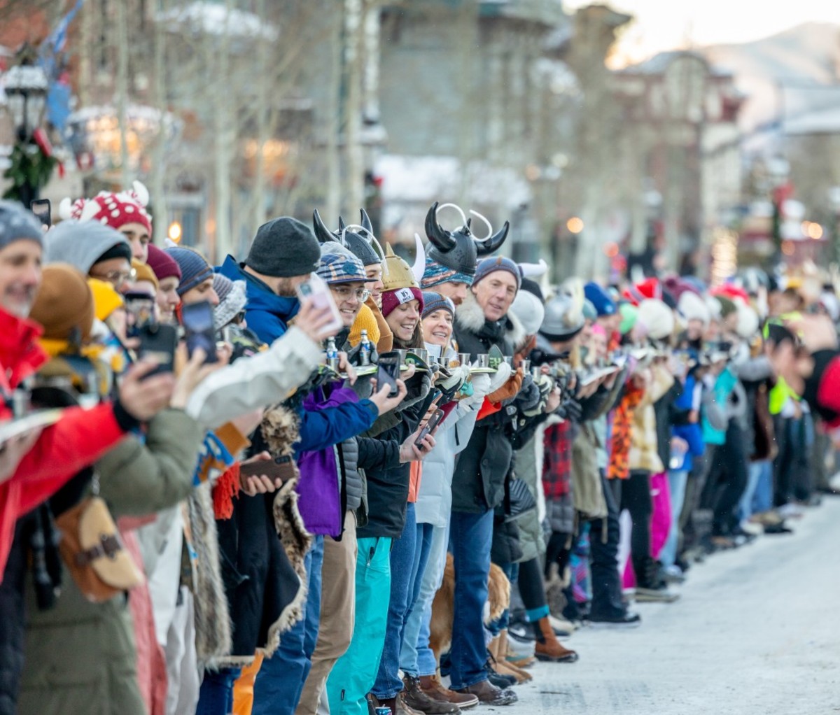 Long line of people preparing to do shot ski