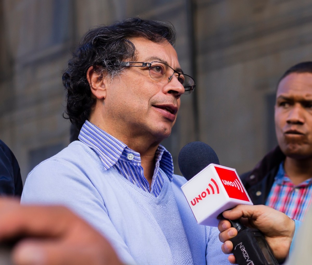 Colombian President Gustavo Petro speaks into a mic.