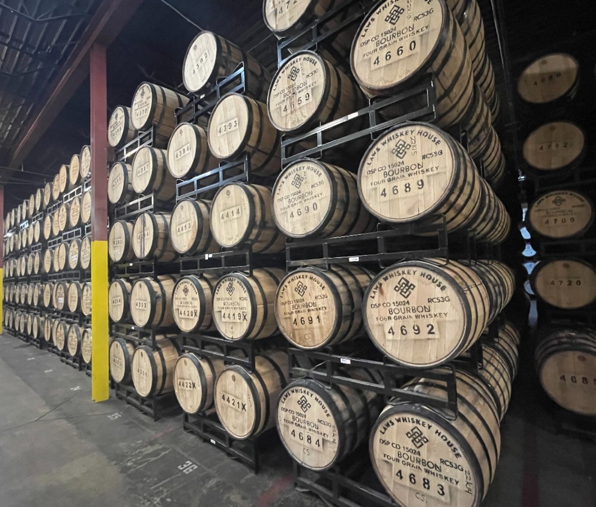 Rows of barrels in the warehouse at Laws distillery.