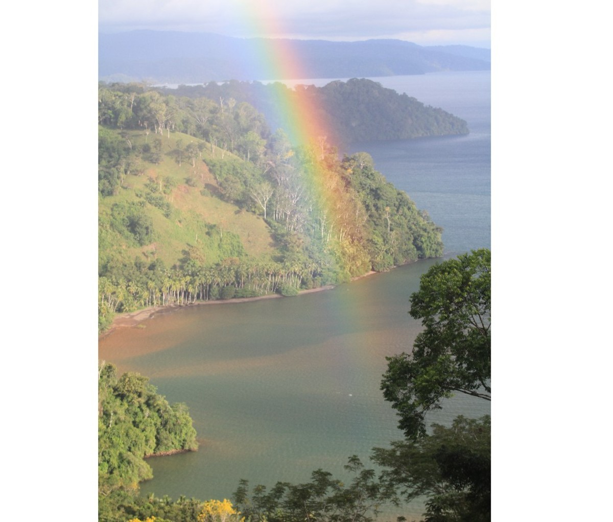 Coastal vista of Corcovado National Park with a rainbow.
