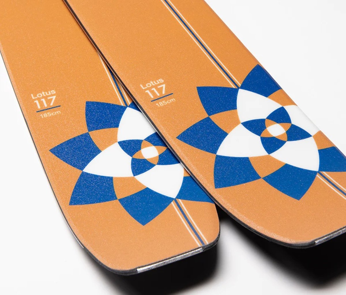 Orange skis with blue and white lotus pattern