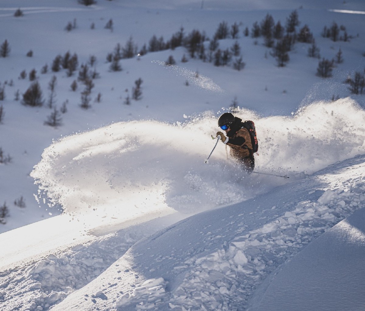 Skier on a powder slope in the alps. 