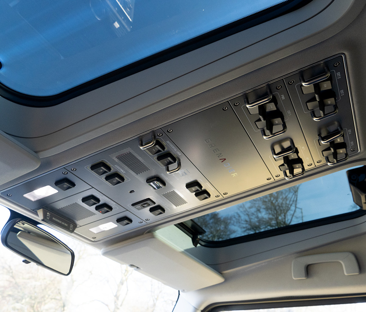 Ceiling mounted control panel for a 4x4 SUV.