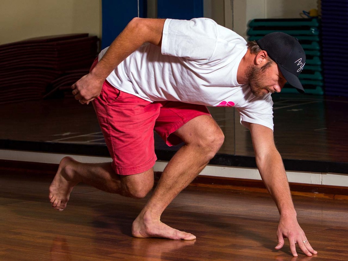 Olympic skiier Bode Miller practices a one-leg standing reach. Olympic skiier Bode Miller practices a one-leg standing reach. Bode Miller trains on a stationary bike. Photo courtesy Jonathan Selkowitz.