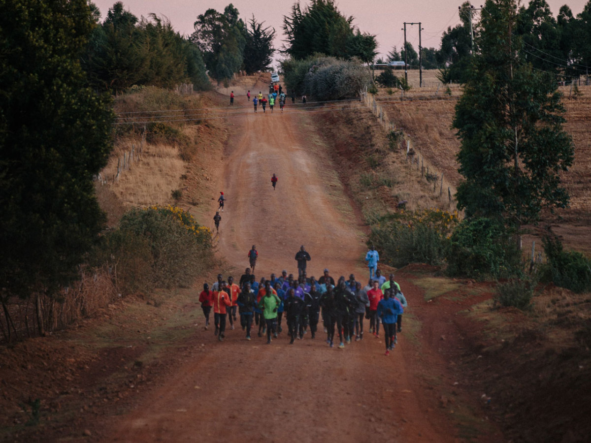 Nike marathoner Eliud Kipchoge running with training camp Nike marathoner Eliud Kipchoge running with training camp