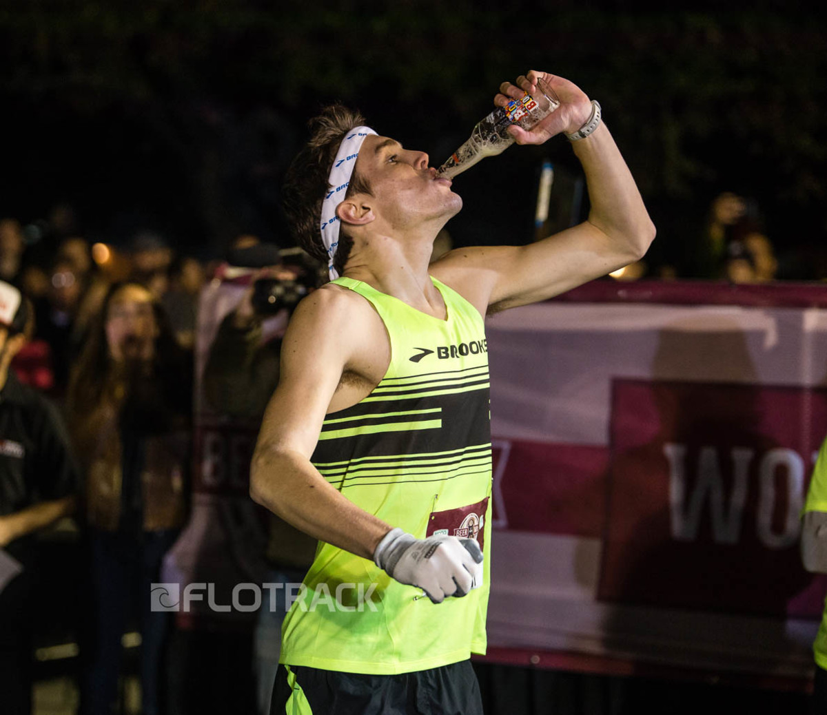 Lewis Kent chugs a beer during the FloTrack Beer Mile on Dec. 1, 2015, in Austin, Tx. Photo via FloTrack / Caleb Kerr Photography